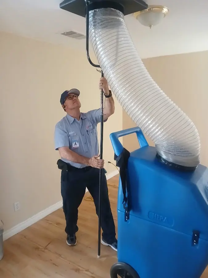 Furnace Tune-Up technician using HEPA equipment in Wheatfield